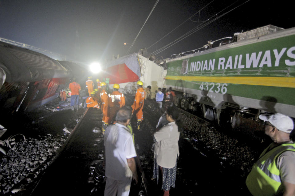 Rescuers work at the site of passenger trains accident, in Balasore district, in the eastern Indian state of Orissa, Saturday, June 3, 2023.Two passenger trains derailed in India, killing more than 200 people and trapping hundreds of others inside more than a dozen damaged rail cars, officials said. (AP Photo)