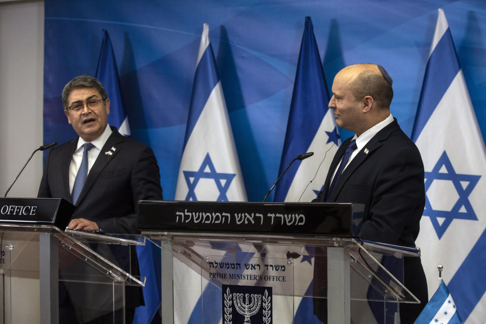 Israeli Prime Minister Naftali Bennett, right, and Honduran President Juan Orlando Hernandez, give statements at the prime minister's office, in Jerusalem, Thursday, June 24, 2021. (Heidi Levine/Pool via AP).