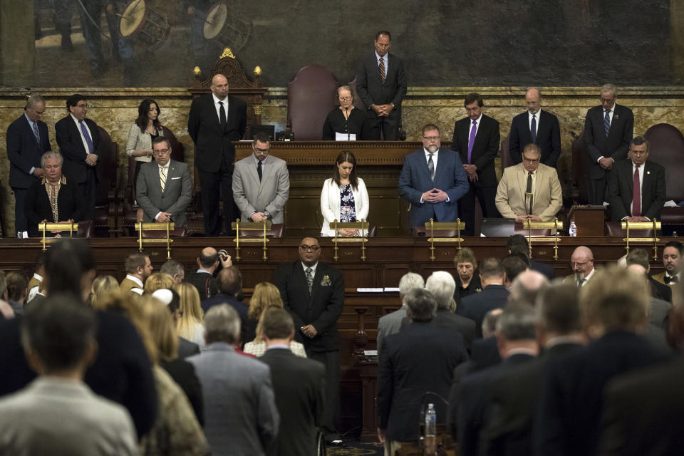 Dor Hadash Rabbi Cheryl Klein prays with Pennsylvania lawmakers who came together in an unusual joint session to commemorate the victims of the Pittsburgh synagogue attack that killed 11 people last year, Wednesday, April 10, 2019, at the state Capitol in Harrisburg, Pa. (AP Photo/Matt Rourke)