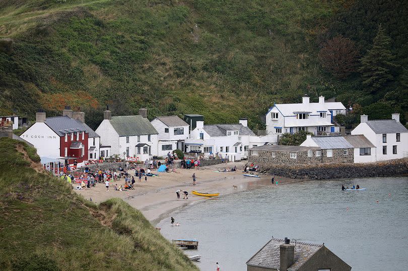 The Ty Coch Inn is nestled in a scenic sandy cove in Porthdinllaen