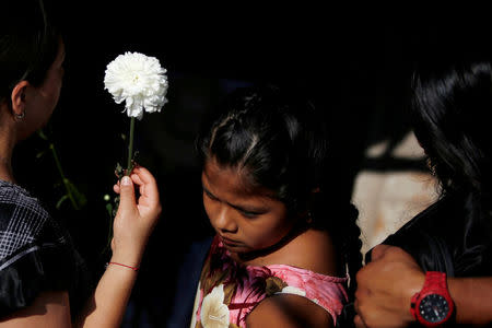 Family members react during the burial of German Torres, 38, a victim of the earthquake that struck the southern coast of Mexico late on Thursday, in Juchitan, Mexico, September 9, 2017. REUTERS/Carlos Jasso