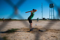 <p>Teenage boys play baseball on a dirt lot in Tangier, Virginia, May 16, 2017, where climate change and rising sea levels threaten the inhabitants of the slowly sinking island.<br> (Jim Watson/AFP/Getty Images) </p>