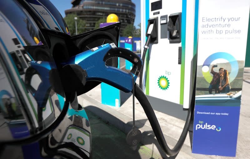 FILE PHOTO: An electric powered taxi is seen being charged at a BP Pulse electric vehicle charging point in London