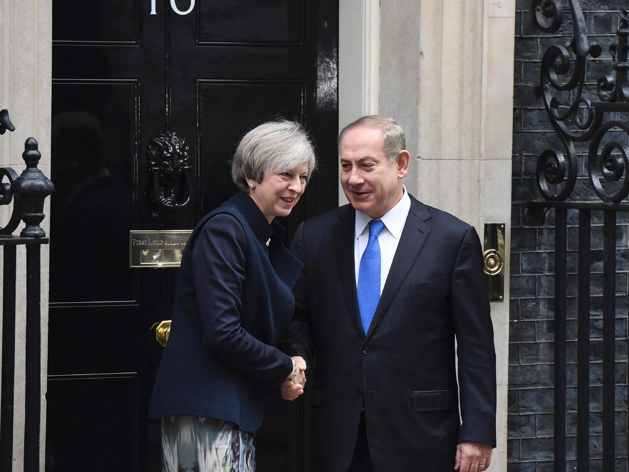 Theresa May shaking hands with Israeli Prime Minister Benjamin Netanyahu after Netanyahu arrived for a meeting at 10 Downing Street in central London: Getty