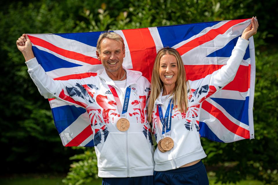 Dujardin and team mate Carl Hester raise the Union flag in celebration of their medal wins in Tokyo (Ben Birchall/PA) (PA Wire)