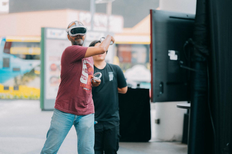 A visitor at the roving Olympic Esports Week trailer trying out virtual reality games. (PHOTO: Olympic Esports Week)