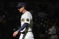 Milwaukee Brewers' Craig Counsell walks back to the dugout after making a pitching change during the sixth inning of a baseball game against the Miami Marlins, Sunday, Oct. 2, 2022, in Milwaukee. (AP Photo/Aaron Gash)