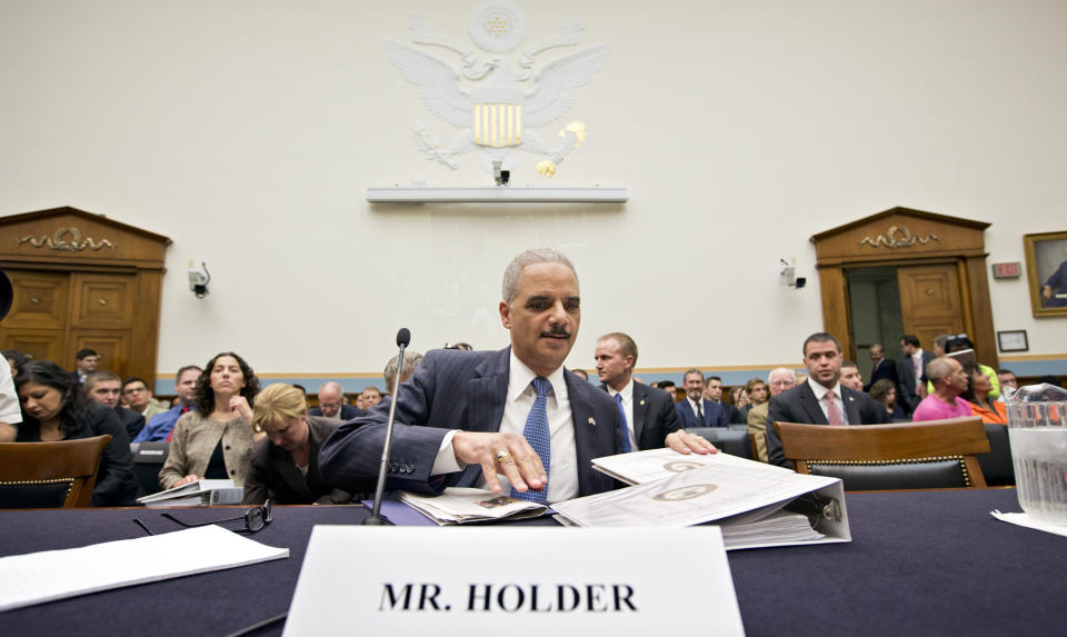 Attorney General Eric Holder, the nation's top law enforcement official, prepares to testify on Capitol Hill in Washington, Wednesday, May 15, 2013, before the House Judiciary Committee oversight hearing on the Justice Department. House Judiciary Committee Chairman Rep. Bob Goodlatte,R-Va., wants to know more about the unwarranted targeting of Tea Party and other conservative groups by the Internal Revenue Service and the Justice Department's secret seizure of telephone records at The Associated Press. (AP Photo/J. Scott Applewhite)