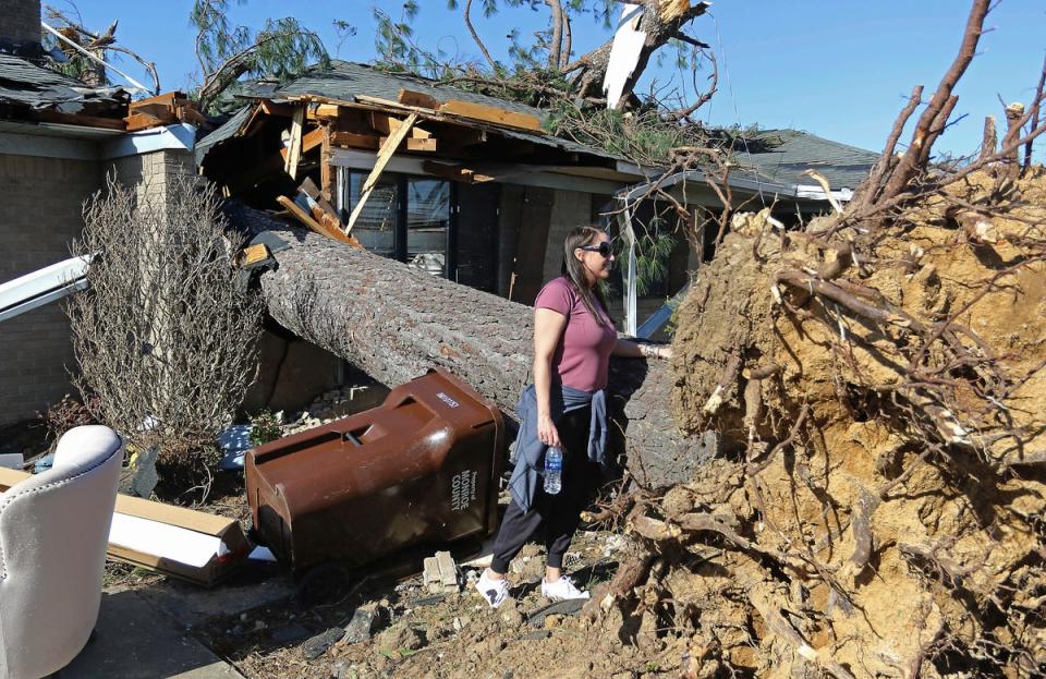 A resident surveys the damage (AP)