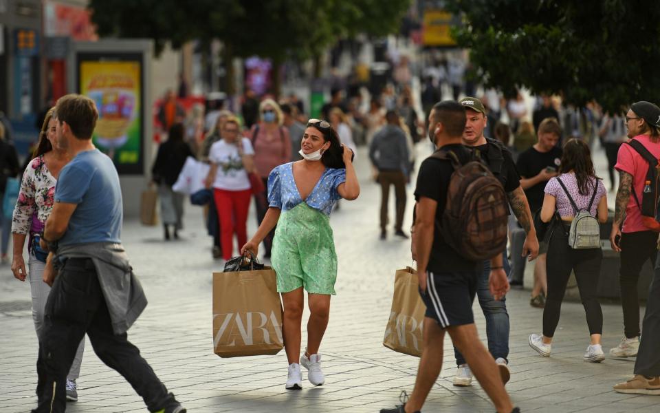 Shops, restaurants and pubs in Liverpool remain open despite a spike in cases - Oli Scarff /AFP