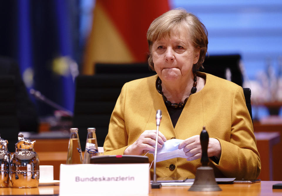 FILE - In this Wednesday, March 24, 2021 file photo, German Chancellor Angela Merkel attends the weekly cabinet meeting of the German government at the chancellery in Berlin. German Chancellor Angela Merkel has talked about her country’s difficulties, during the coronavirus pandemic. In a lengthy television interview late Sunday she called for greater flexibility to tackle the latest surge in cases. (Kay Nietfeld/Pool via AP, File)