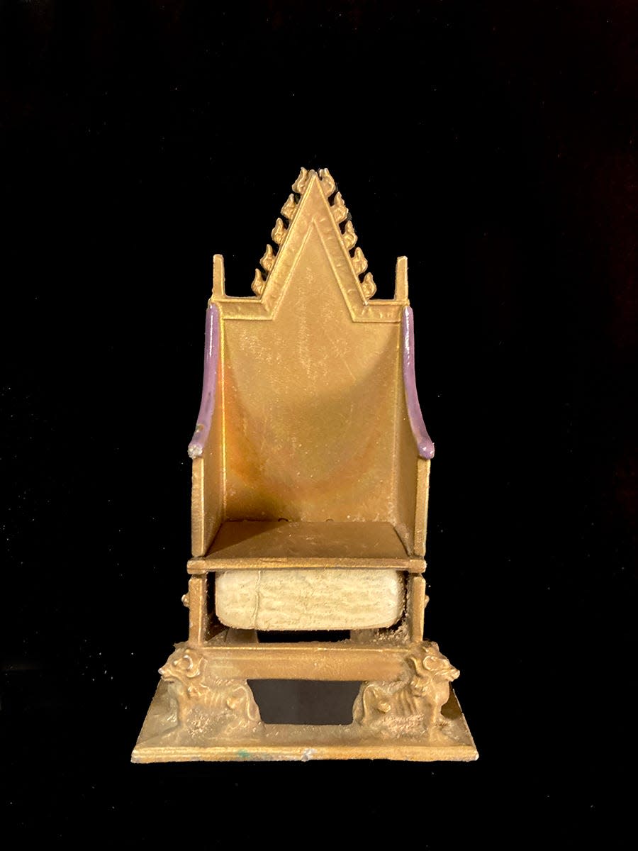 This small model of the British Coronation Chair includes the Stone of Scone under the seat.