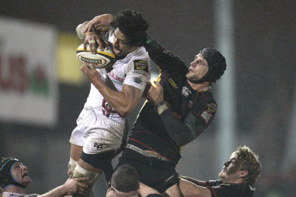 South Wales Argus: ICON: Ospreys forward Filo Tiatia in action against Dragons great Luke Charteris at Rodney Parade