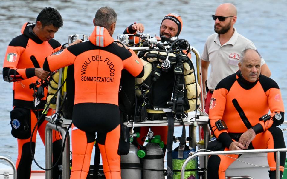 Divers of the Vigili del Fuoco, the Italian Corps. of Firefighters work in Porticello