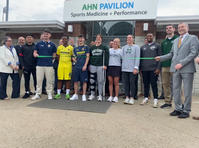 Student-athletes from Mercyhurst University and Erie Prepatatory Academy cut the ribbon on Allegheny Health Network’s new sports medicine and performance facility at Erie Sports Center.