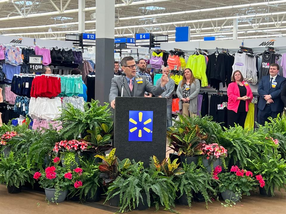 Jimmy Goins, manager of the Walmart Supercenter in Henderson, makes remarks during a celebration of the completion Friday of a $6 million remodeling of the 203,000-square-foot store this year.