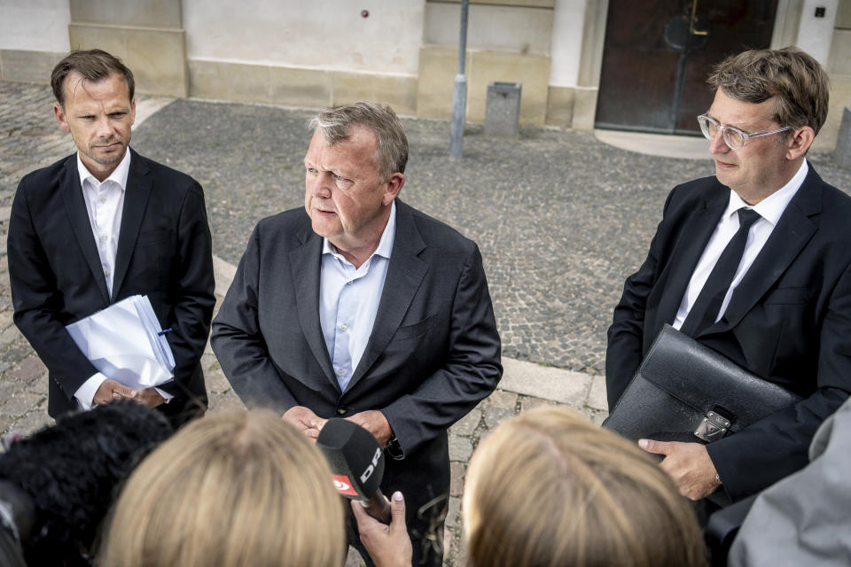 FILE - Denmark's Minister of Foreign Affairs Lars Loekke Rasmussen, centre, Minister of Justice Peter Hummelgaard, left and acting Minister of Defense Troels Lund Poulsen address the media after a briefing by members of the Danish Parliament on the international reactions to the Quran burnings, in Copenhagen, Monday, July 31, 2023. A new law was passed in Denmark's parliament on Thursday, Dec. 7, 2023, that makes it illegal to desecrate any holy text in the country, after a recent string of public desecrations of the Quran by a handful of anti-Islam activists sparked angry demonstrations in Muslim countries. (Mads Claus Rasmussen/Ritzau Scanpix via AP, File)