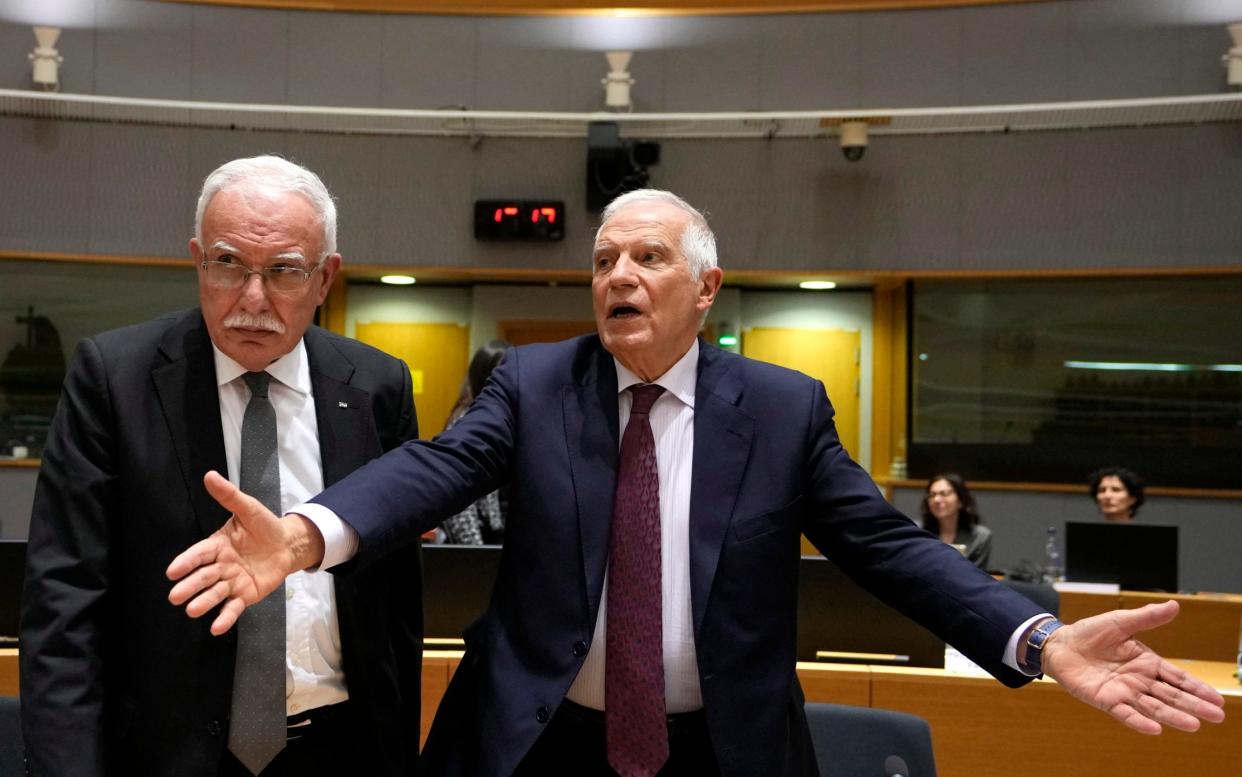 Palestinian Authority Foreign Minister Riyad al-Maliki (L) speaks with European Union High Representative for Foreign Affairs Josep Borrell