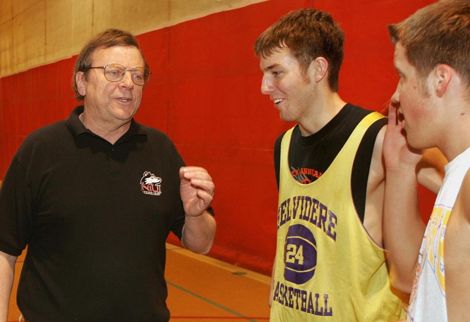 Then-Belvidere High School basketball coach Jack McCarthy talks with players Adam Heaton (center) and Jason Fiske during practice at the school in 2003.