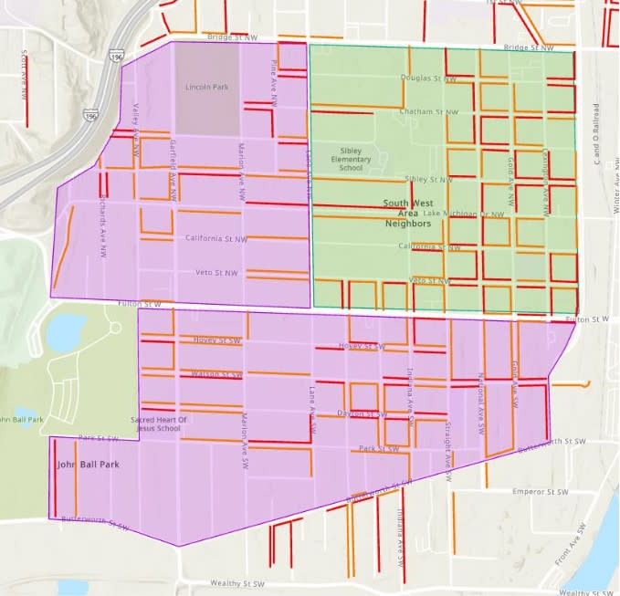 A map of the section of John Ball Area Neighborhood that would require residential permit parking under a proposal. The green shading denotes a start date of November 2024. The purple shading indicates a 2025 date. (Courtesy City of Grand Rapids)