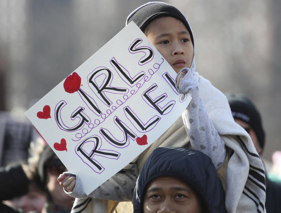 A girl holds a sign as she takes part in the Second Annual Women's March Chicago.