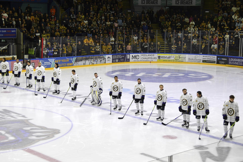 CAPTION CORRECTS PLAYERS' TEAM Manchester Storm players wearing number 47, Adam Johnson's number, pay tribute before the Ice Hockey Adam Johnson memorial game between Nottingham Panthers and Manchester Storm at the Motorpoint Arena, Nottingham, England, Saturday, Nov. 18, 2023. The memorial game is held three weeks after Adam Johnson, 29, suffered a fatal cut to his neck during a game against Sheffield Steelers on Saturday, October 28. (AP Photo/Rui Vieira)