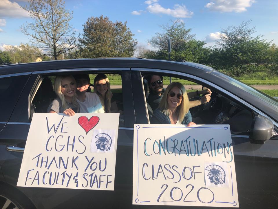 Class of 2020 graduate Annabelle Poppe (left), boyfriend, Michael, and sister, Faith, are paraded back through Cary-Grove High School by parents, Chris and Jen. (Eric Edholm/Yahoo Sports)