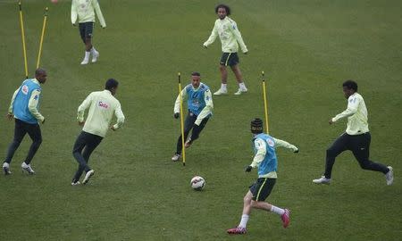 Brazil's national team players attend a training session at Charlety stadium in Paris March 24, 2015. France will play against Brazil in their International friendly soccer match on Thursday March 26. REUTERS/Gonzalo Fuentes