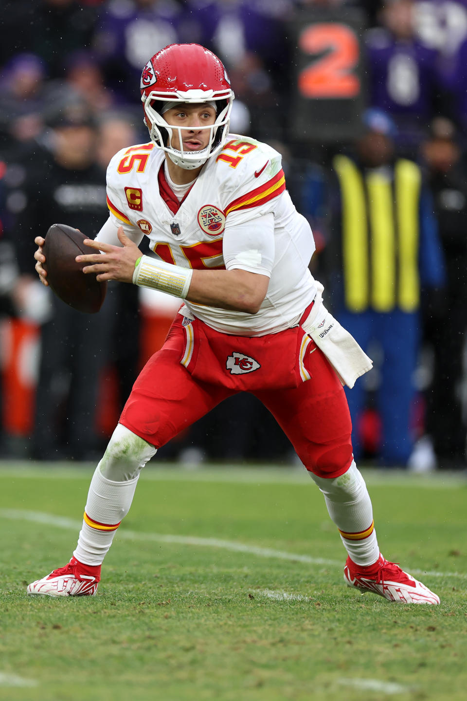 Patrick Mahomes #15 of the Kansas City Chiefs rolls out to pass against the Baltimore Ravens in the AFC Championship Game  at M&T Bank Stadium on January 28, 2024 in Baltimore, Maryland. (Photo by Rob Carr/Getty Images)