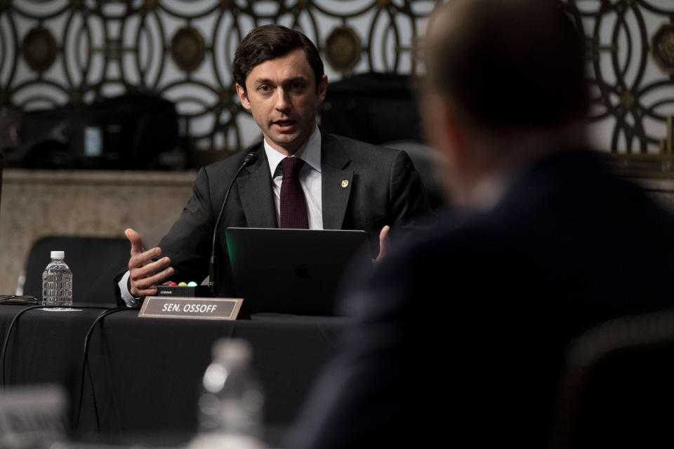 Sen. Jon Ossoff, D-Ga., questions former U.S. Capitol Police Chief Steven Sund, foreground, during a Senate Homeland Security and Governmental Affairs & Senate Rules and Administration joint hearing on Capitol Hill, Washington, Tuesday, Feb. 23, 2021, to examine the January 6th attack on the Capitol. (AP Photo/Andrew Harnik, Pool)