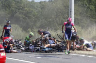 Riders and their bicycles fill the road after a fall during the 159,5 km (99 miles) third stage of the 102nd Tour de France cycling race from Anvers to Huy, Belgium, July 6, 2015. REUTERS/Eric Gaillard