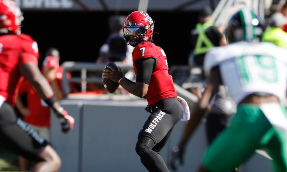 N.C. State quarterback MJ Morris (7) looks for a receiver downfield during the first half of N.C. State’s game against Marshall at Carter-Finley Stadium in Raleigh, N.C., Saturday, Oct. 7, 2023.