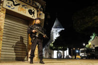 <p>French riot police guards the street to access the church where an hostage taking left a priest dead in Saint-Etienne-du-Rouvray, Normandy, France, Tuesday, July 26, 2016. (AP Photo/Francois Mori)</p>