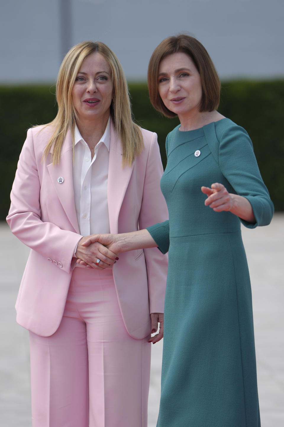 Moldova's President Maia Sandu, right, greets Italy's Prime Minister Giorgia Meloni during arrivals for the European Political Community Summit at the Mimi Castle in Bulboaca, Moldova, Thursday, June 1, 2023. Leaders are meeting in Moldova Thursday for a summit aiming to show a united front in the face of Russia's war in Ukraine and underscore support for the Eastern European country's ambitions to draw closer to the West and keep Moscow at bay. (AP Photo/Vadim Ghirda)