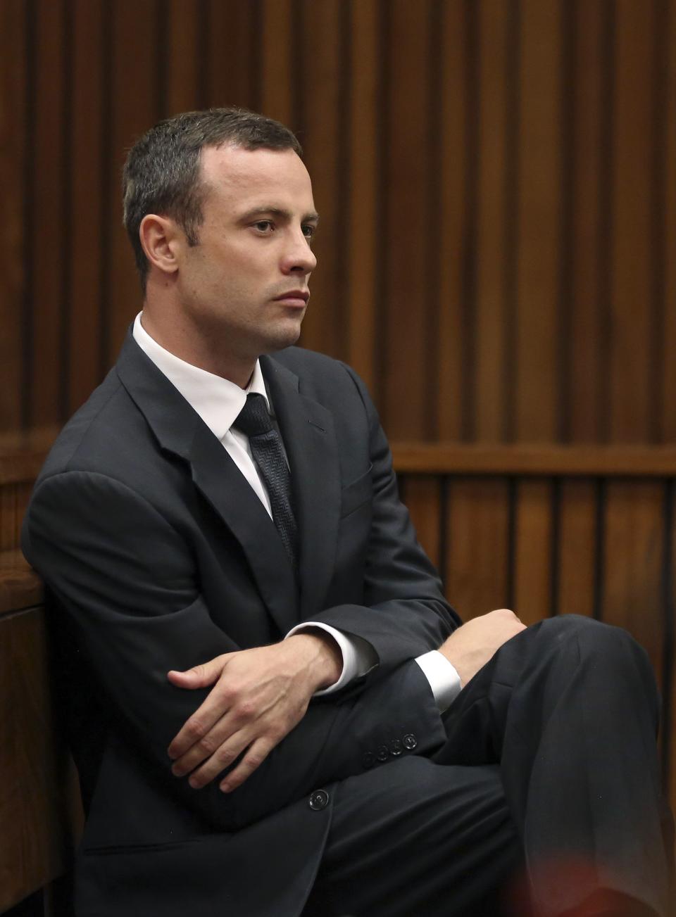 Olympic and Paralympic track star Oscar Pistorius sits in the dock during the fifth day of his trial, for the murder of his girlfriend Reeva Steenkamp, at the North Gauteng High Court in Pretoria March 7, 2014.REUTERS/Themba Hadebe/Pool (SOUTH AFRICA - Tags: SPORT ATHLETICS CRIME LAW)