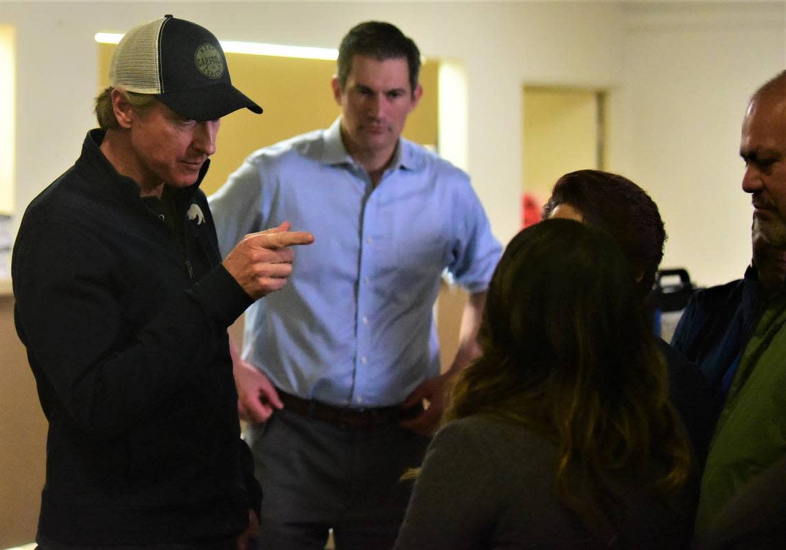 Governor Gavin Newsom talks to local Merced and Merced County leaders as Newsom visited the evacuation center set up at the Merced County Fairgrounds on Saturday, Jan. 14, 2023.