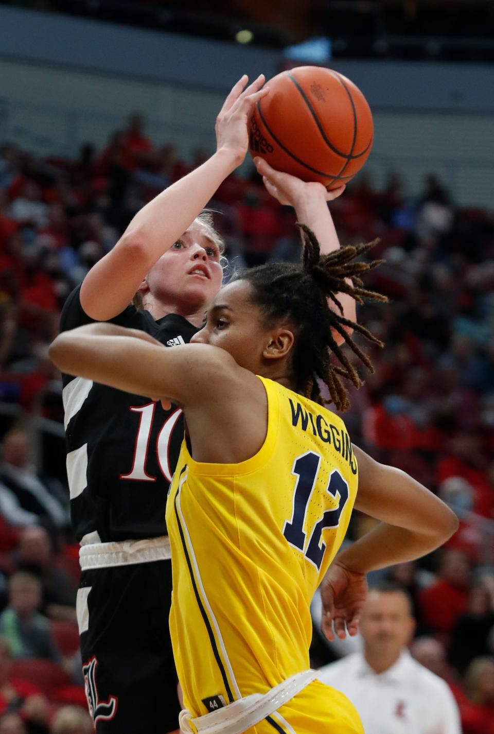 Louisville’s Hailey Van Lith makes a bucket against Michigan’s Ari Wiggins.Dec. 2, 2021