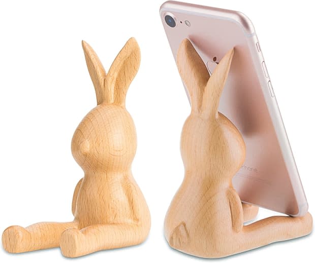 <p>This rabbit phone holder is made from solid beech and walnut wood. It's free from chemicals and toxic substances. It's so cute, your teen will enjoy using it every single day.</p><p><em><a href="https://www.amazon.com/AhfuLife-Decoration-Multi-Functional-Organizer-Christmas/dp/B07BGRYNY8?crid=2KZBZM20TT9YK&keywords=bunny%2Bgift&qid=1677455933&sprefix=bunny%2Bgift%2Caps%2C160&sr=8-46&th=1&linkCode=ll1&tag=parade03-20&linkId=3b583fbd4fe774b2c115261992a7656b&language=en_US&ref_=as_li_ss_tl" rel="nofollow noopener" target="_blank" data-ylk="slk:Bunny Phone Holder/Stand, $20.99 on Amazon;elm:context_link;itc:0;sec:content-canvas" class="link ">Bunny Phone Holder/Stand, $20.99 on Amazon</a></em></p><p>Amazon</p>