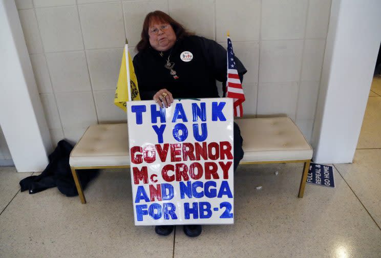 Supporter of HB2 Lee Churchill from Raleigh, N.C. holds a sign stating her position outside the North Carolina House and Senate chambers gallery on Wednesday, Dec. 21, 2016 as the North Carolina General Assembly convenes for a special session at the Legislative Building in Raleigh, N.C. (Photo: Chris Seward/Raleigh News & Observer/TNS via Getty Images)