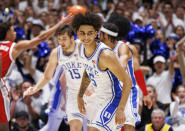 Duke's Tyrese Proctor (5) smiles at his bench after hitting a three-point shot during the first half of an NCAA college basketball game against Ohio State in Durham, N.C., Wednesday, Nov. 30, 2022. (AP Photo/Ben McKeown)