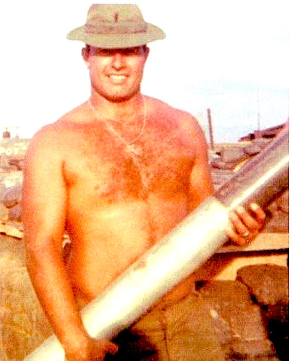 An All-American tackle from Oklahoma, Bob Kalsu played for the Buffalo Bills in 1968. By 1970, his artillery battery was supporting the 101st Airborne in the notorious A Shau Valley. On July 21 Kalsu was killed by a mortar round. This photo shows Kalsu toting a 100-pound shell.
