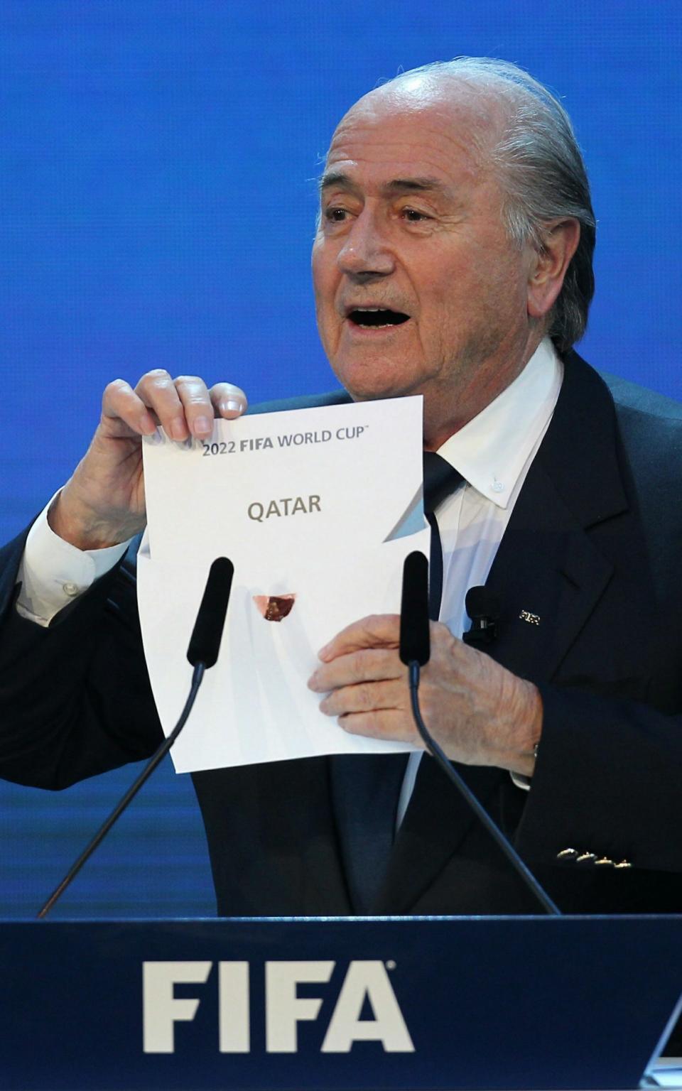 Sepp Blatter revealing Qatar as the winning bid for 2022 - Credit: KARIM JAAFAR/AFP