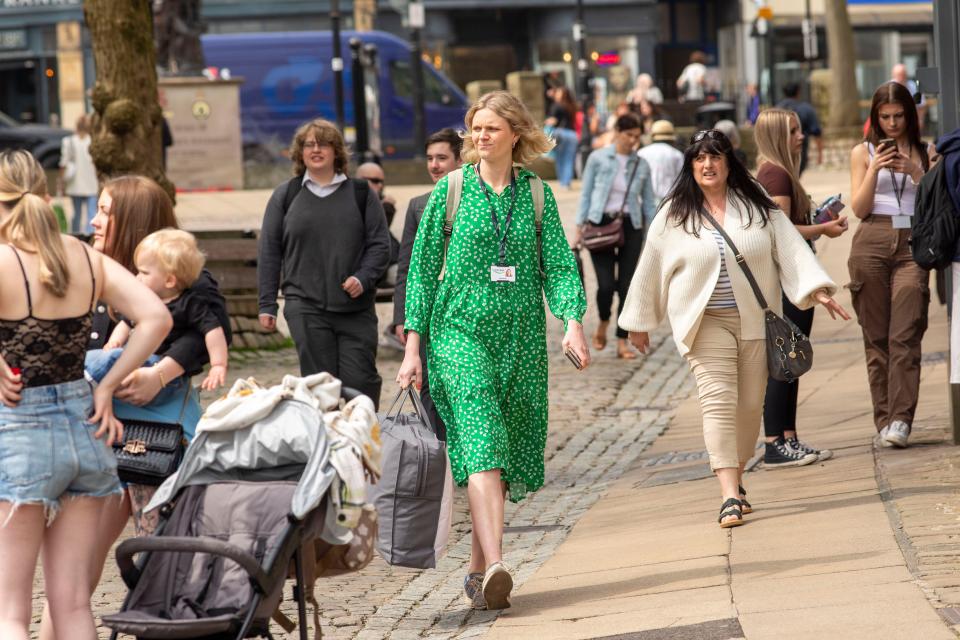 Shoppers in Halifax, West Yorkshire on the day the UK came out of recession