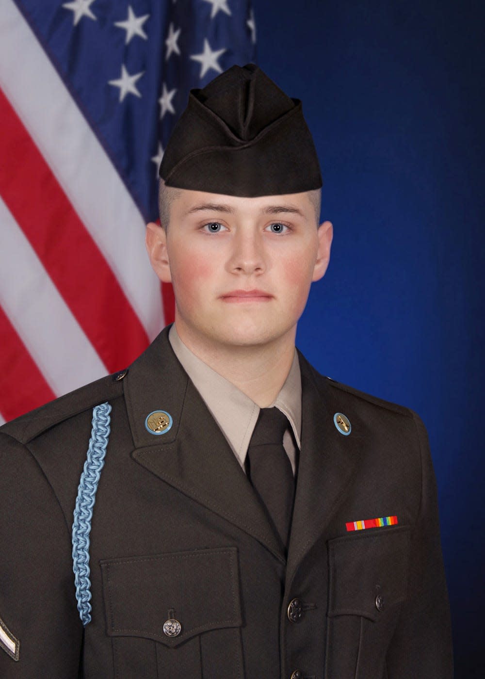Private First Class Jacob T. Atchison from Pella poses in uniform.