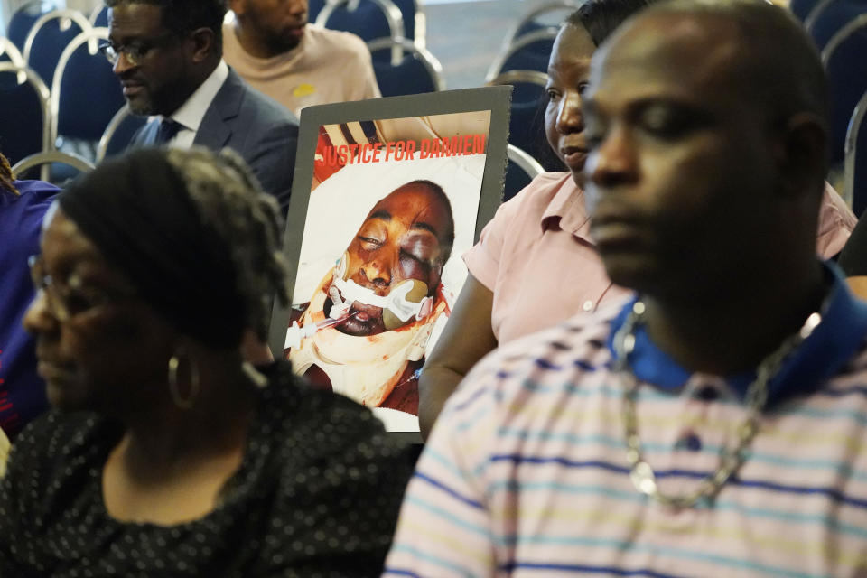 The families of Michael Corey Jenkins and Damien Cameron sit together prior to interacting with U.S. Assistant Attorney General Kristen Clarke of the Justice Department's Civil Rights Division, unseen, during the Jackson, Miss., stop on the division's civil rights tour, June 1, 2023. Jenkins, who was shot in the mouth by Rankin County deputies, is at the center of a federal civil rights probe into the sheriff's office. Cameron died after getting arrested by deputies from the same sheriff's office. Mississippi is the latest stop in Clarke's "listening tour" throughout the Deep South. (AP Photo/Rogelio V. Solis)