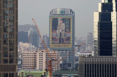 A portrait of Thai King Maha Vajiralongkorn is seen on a building on the eve of his 65th birthday in Bangkok, Thailand July 27, 2017. REUTERS/Jorge Silva