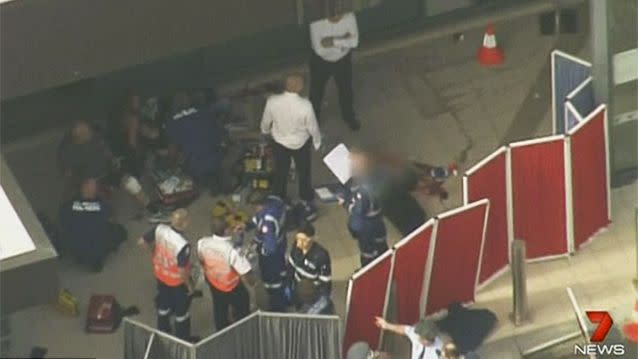 Heavily armed officers swamped the scene and police helicopters hovered over the shopping centre went into virtual lockdown. Photo: 7 News