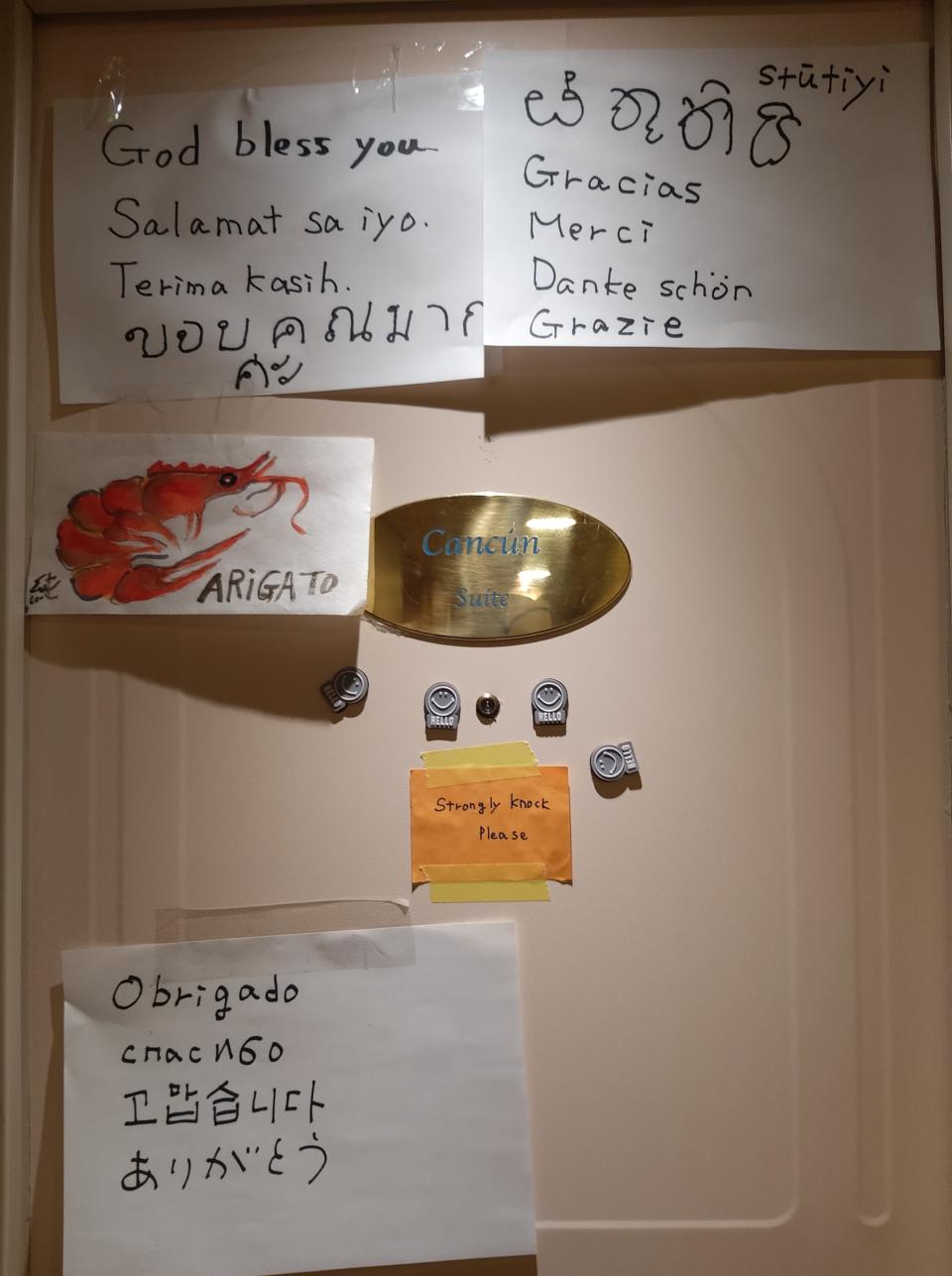 Thank you notes to crew in multiple languages are stuck to the door of a cabin aboard the quarantined Diamond Princess ship | Sent to TIME via Gie, a <em>Diamond Princess</em> crew member