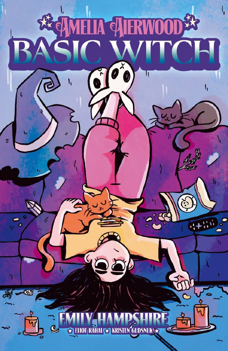 Amelia sits upside down on the couch with 2 cats on the cover of Amelia Aierwood: Basic Witch