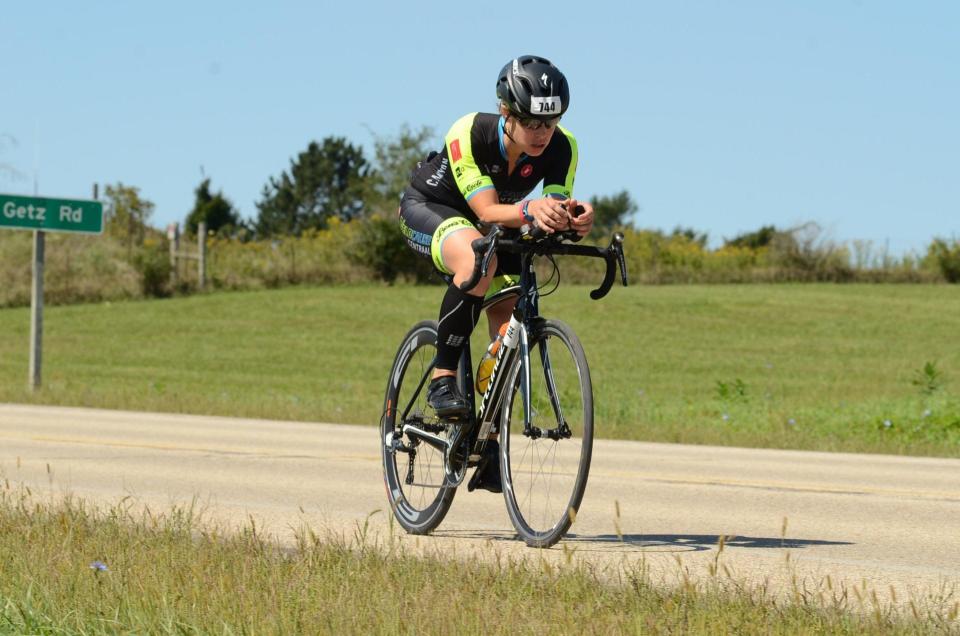 Greendale native and UWM graduate Brittany Heintz Walters races the bike portion of Madison's Ironman Wisconsin in 2019.